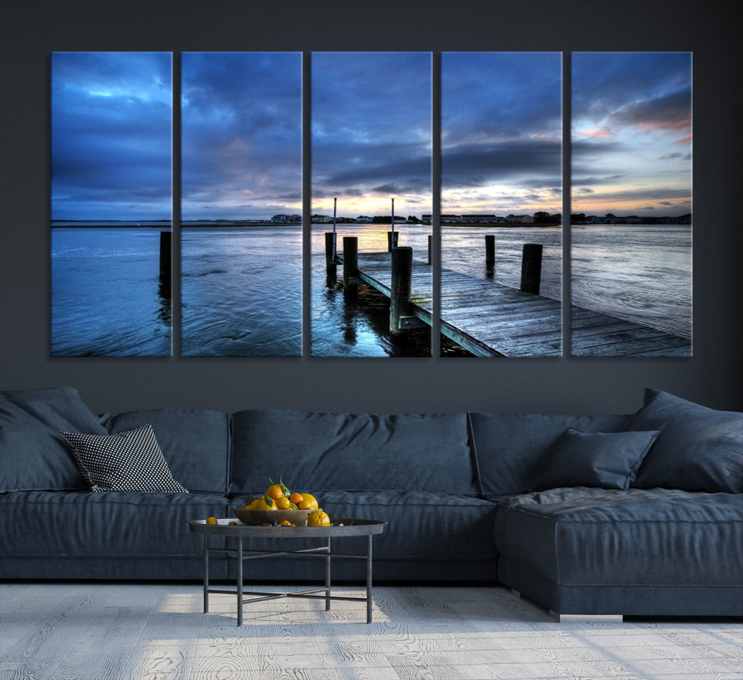 Wall Art Canvas Print Pier on Dark Sea with Town Behind at Sunset
