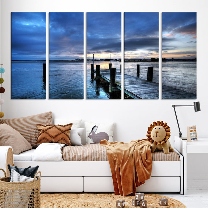 Wall Art Canvas Print Pier on Dark Sea with Town Behind at Sunset